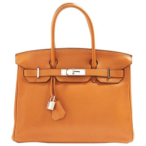 who owns hermes bags.